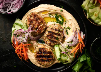 Elevate your mealtime with these delicious and nutritious Chicken Koftas served with creamy hummus and fresh veggies.