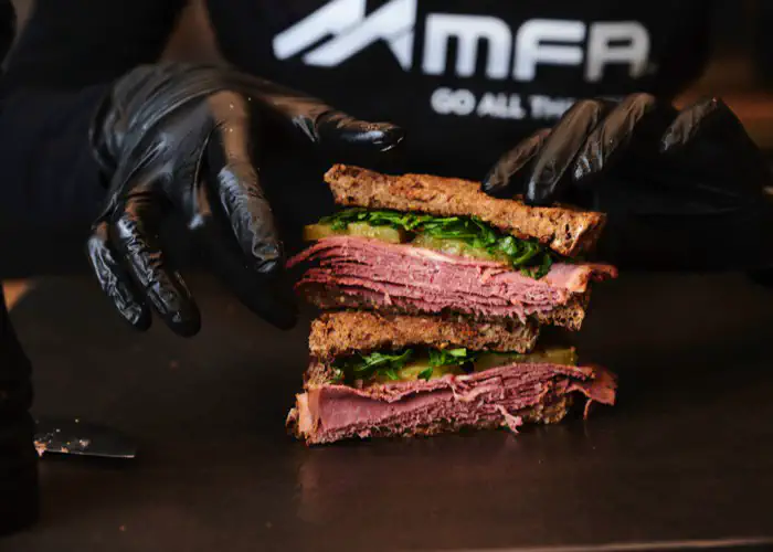 Indulge in a savory and tangy Pastrami & Arugula Sandwich that packs a punch! This easy-to-make sandwich features high-protein bread toasted to perfection.